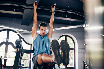 Image showing Fitness, pull ups workout and man in gym on bars training for health, wellness and strength. Energy, personal trainer and male body builder from Canada exercising for muscle power in fitness center.