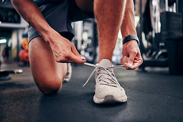 Image showing Gym, hands and man tie shoes getting ready for workout, training or exercise. Fitness, sports or male athlete in fitness center preparing for running, cardio or bodybuilding practice in health studio