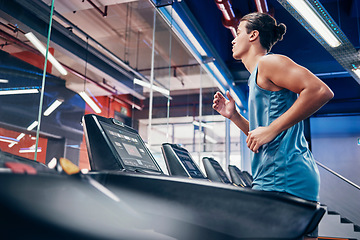 Image showing Fitness, man and running on treadmill for workout, exercise or cardio training for endurance at the gym. Active male runner in sports wellness having a run on stationary equipment at the health club