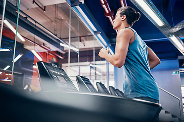 Image showing Gym, fitness and man running on treadmill for health, wellness and cardio exercise, alone and power. Runner, workout and guy at sports center for training, energy and endurance, speed and performance