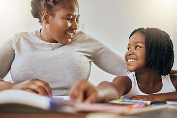 Image showing Mother with young girl, learning with books in home and studying for test in Kenya. Homeschooling education, happy child writing homework and mama helping daughter with knowledge development