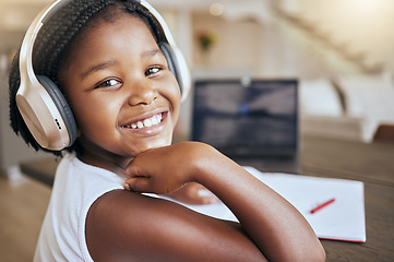 Image showing Education, homework and African girl with music for learning studying and elearning with school books in house. Podcast, happy and portrait of a young child with headphones during study for knowledge