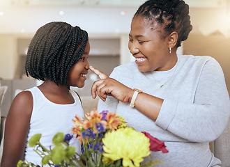 Image showing Love, mother and girl smile, happy and together for bonding, loving and happiness together. Mama, daughter and black family being playful, caring and quality time being cheerful in home with flowers.