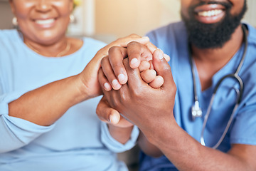 Image showing Nurse, holding hands and patient support, kind and care with doctor giving black woman care for diagnosis or treatment. Console, trust and compassion with gp or nursing staff in healthcare hold hand