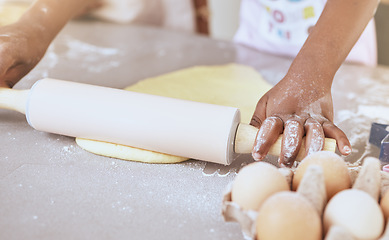 Image showing Child, baking and cooking with hands on table with rolling pin for pizza, pastry or cookie dough on messy kitchen counter with flour and eggs. Learning, hobby and girl learning skill to cook at, home