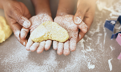 Image showing Heart, love with hands and bake with dough, teaching and learning baking skill, parent and child together making cookies. Family, bonding and learn for development with flour, baker and quality time.