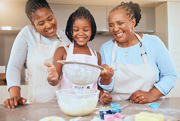 Image showing Happy family, child and cooking in kitchen together for bonding or learning development activity. Black family, grandmother and mother teaching kid baking skills for independence in retiement home