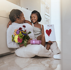 Image showing Mother, child and mothers day card and gift with flowers as a gift for loving mom at home. Family, children and daughter with present for love, care and affection for female parent with note