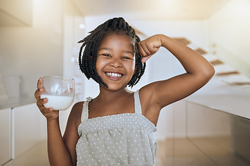 Image showing Milk, portrait and African girl with muscle from healthy drink for energy, growth and nutrition in the kitchen. Happy, smile and child flexing muscles from calcium in a glass and care for health