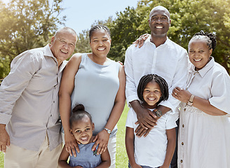 Image showing Portrait of happy black family with smile in park, garden or outdoor picnic venue. Men, women and kids together on grass at family event and making memories, generations with girl children and couple