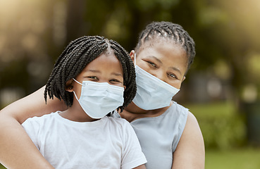 Image showing Black mother, girl and covid face mask at park for health, safety and protection from virus infection. Family, love and covid 19 compliance, mom bonding and care with child outdoors in nature garden.