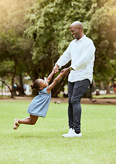 Image showing Black man, spinning child and happy at park for funny game, play or bonding outdoor in summer. Father, girl and swing with hands on lawn, grass or garden with love, care or happiness in black family