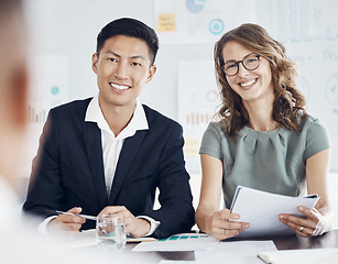 Image showing Business meeting, partnership and team in b2b discussion with graphs or infographics for financial budget for startup proposal idea. Diversity of asian man and a woman consulting in corporate office