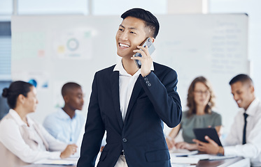 Image showing Businessman, phone call and networking with communication, conversation and meeting with workers in office. Asian man, ceo and leader in workshop, talking and mobile smartphone at group work seminar