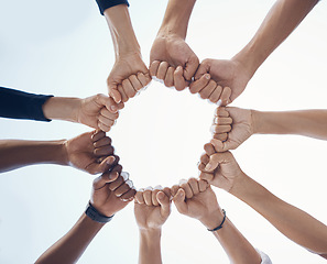 Image showing Hands, trust and support fist circle with low angle for loyalty, mission and friends with cooperation. Connection, hope and community of people together for social commitment, community and trust