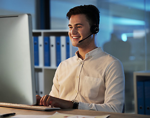 Image showing Customer support service employee, smile at night and working on helping client with faq solution in digital call center. Telemarketing business, crm consultant at office desk and online consultant