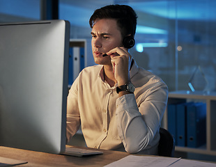 Image showing Businessman, telemarketing and consulting working at night in the office for customer service or advice. Man in contact us, consultation or help with headset for insurance, investing or communication