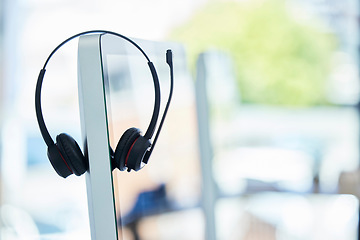 Image showing Call center, headset and computer with office background, consulting and technology for crm, communication or help. Workplace, customer service or telemarketing pc on desk for work, agency or support