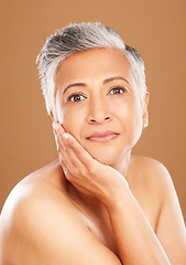 Image showing Skincare, wellness and portrait of senior black woman isolated in studio on orange background. Beauty, cosmetics and old female pose for anti aging beauty products, skincare products and body care