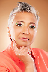 Image showing Makeup, creative and senior woman with fashion, beauty and designer luxury against a brown studio background. Stylish, retirement and portrait of elderly model with an idea for cosmetics and style