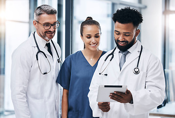 Image showing Health, nurse and doctors with tablet for medical information, online and technology in healthcare and medicine in hospital. Professional medical team, men and woman check digital health care record.