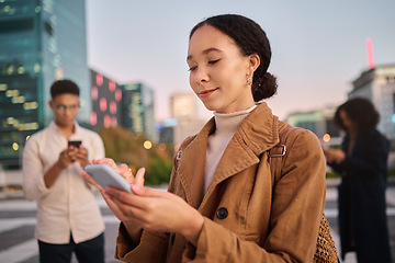 Image showing Phone, black woman and city with people using phone technology and 5g web on the street. Young gen z person texting, internet networking and doing a social media app scroll online typing outdoor