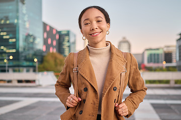 Image showing Portrait, city and commute with a business black woman in town during her evening trip after work. Motivation, vision and smile with a young female employee outdoor on an urban road or street