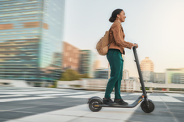 Image showing Electric scooter, travel and black woman with eco friendly transport, urban and clean carbon footprint. Student on commute or journey, speed and sustainability for environment and transportation.