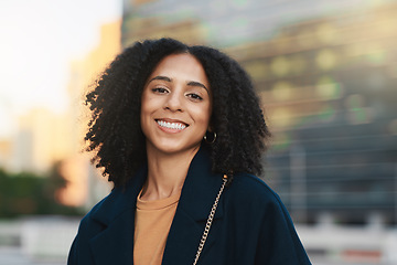 Image showing Portrait, happy and city with a black woman in business standing outside during the day in an urban setting. Face, street and smile with a female employee outdoor in a town for success or development