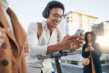 Image showing Black man, social media on smartphone and electric scooter in city traveling to university on sustainable, eco friendly transport and commute. Happy student, cellphone communication and street travel