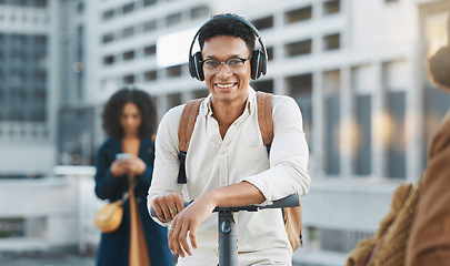 Image showing Music, electric scooter and city with a black man on his commute to work or business in the morning. Portrait, headphones and transport with a male employee commuting or working in an urban town