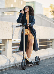 Image showing Happy black woman, scooter and city transport with coffee, smile and outdoor in urban, street or metro. Electric vehicle, transportation or sustainable travel, adventure and carbon neutral travel