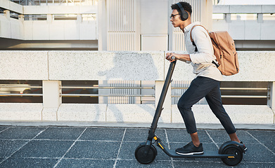 Image showing City, travel and black man with eco scooter for net zero and eco friendly work commute in urban town. Environmental, carbon neutral and worker transportation with music or podcast on electric bike.