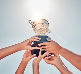Image showing Women, hands or sports trophy in fitness success, workout game or exercise match on summer blue sky. Low angle, team and winner prize cup for school community, training health or wellness award goals