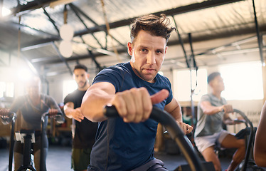 Image showing Bike, class and exercise man portrait with cycling training, wellness and fitness gym group. Athlete with motivation doing a bicycle, sports and spinning workout at a health cub or studio with people