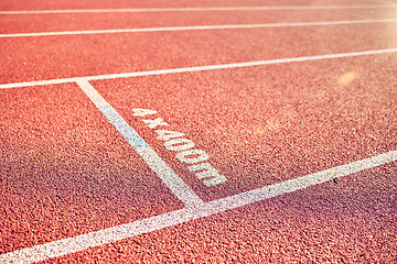 Image showing Sport, running track and stadium background for marathon, race and competition or fitness training for track and field athlete. Line, texture and path with nobody on rubber floor for fast run outdoor