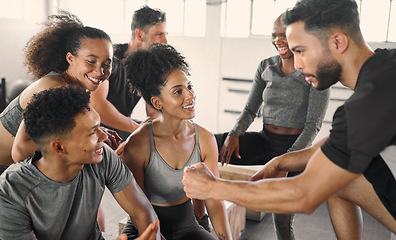 Image showing Communication, fitness and friends with a funny story during exercise, workout and training at the gym. Comic, sports and man talking with motivation to a group of people at a club for wellness