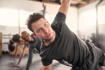 Image showing Fitness, personal trainer and group doing a side plank exercise together for strength in the gym. Strong, sports and strong athletic team doing a intense workout with a coach or leader in health club