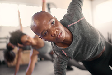 Image showing Fitness class, pilates and black woman focus on balance, wellness and yoga pose in a health studio. Gym training, exercise and workout for peace and healthy sport stretching with women group