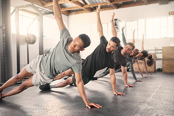 Image showing Fitness, exercise and training with a sports group stretching together in gym class for health or wellness. Workout, diversity and coach with a team warmup in a sport facility for performance