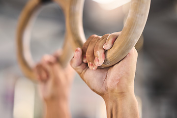 Image showing Gym, hands and rings workout by man for fitness, muscle and training closeup with mockup. Hand, exercise and gym ring pull up by athlete guy cross, energy and endurance challenge, performance and fit