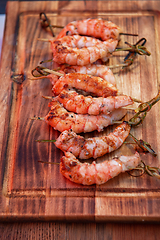 Image showing A professional cook prepares shrimps