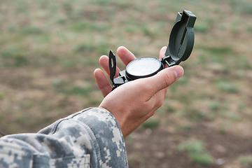 Image showing Man with compass in hand outdoor