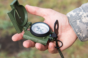 Image showing Man with compass in hand outdoor