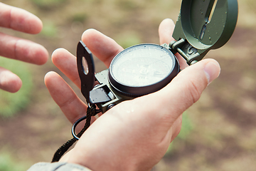 Image showing Man with compass in hand outdoor