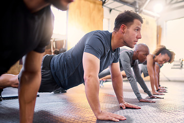 Image showing Wellness, team and push ups in gym, workout and fitness for focus, training together and health. Group, diversity or athletic people in sportswear being healthy, strong or with endurance for exercise