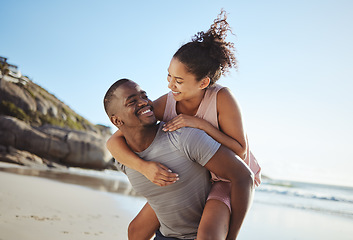 Image showing Love, piggy back and black couple on beach walking, smile and happy together, for bonding and outdoor. Romantic, man carry woman or loving on seaside vacation, holiday and romance for relationship.