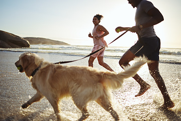 Image showing Exercise, running and couple with their dog on the beach for a cardio workout for sport training. Fitness, sports and healthy man and woman doing a wellness workout with their pet by the ocean or sea