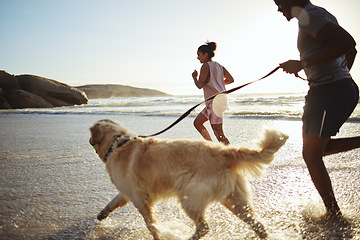 Image showing Dog, black couple and running beach fitness with an animal for morning exercise and runner workout. Training, sport and sea run of people by waves and sand in summer with a golden retriever pet