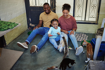 Image showing Family, cats and fun and home with animals, pets and cat together with happiness and bonding. Happy mother, girl and father with pets playing with love, care and smile in a house with happiness